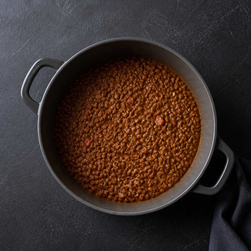 Step 2: Add spices, lentils and tomatoes. Simmer 20 minutes.