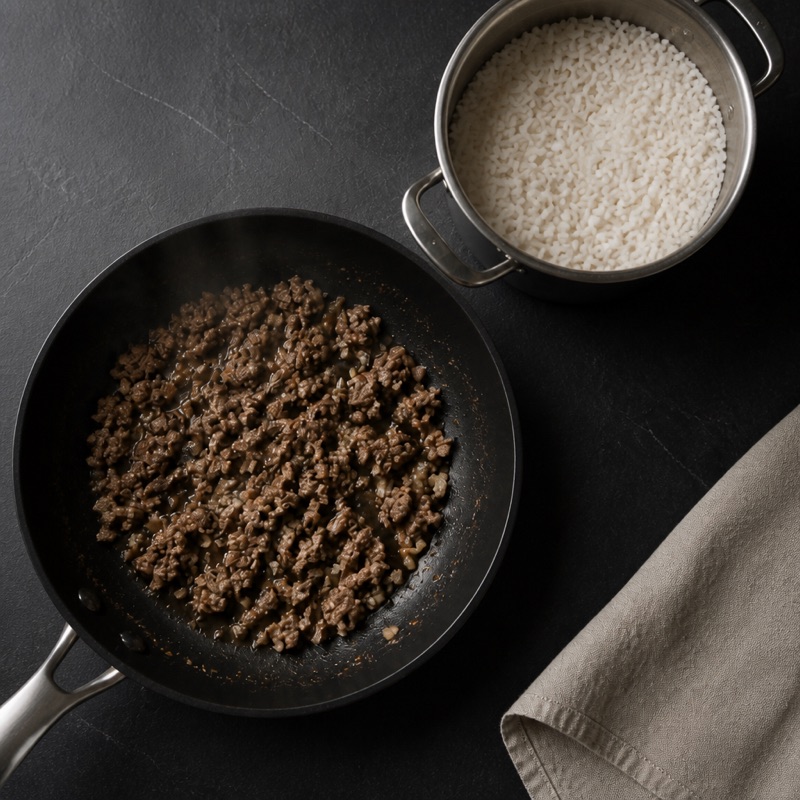 Step 1: Cook rice; brown beef with garlic.